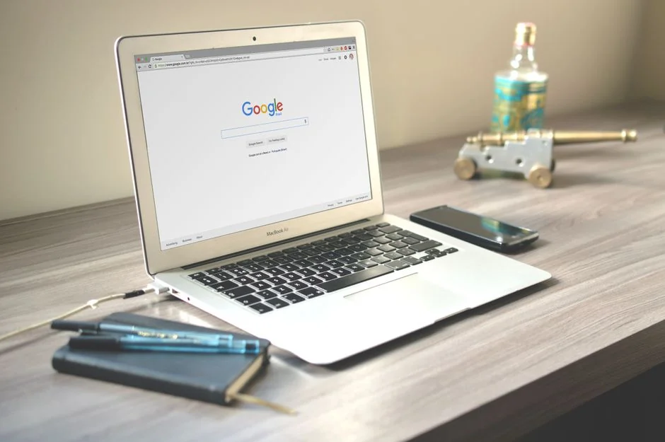 Close-up of a tablet displaying Googles search screen, emphasizing technology and internet browsing.